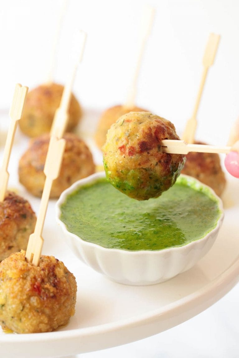 Vertical picture of Vietnamese Chicken Meatballs on toothpicks with dipping sauce