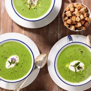 Overhead picture of Fresh Spinach Soup in small blue and white bowls with croutons