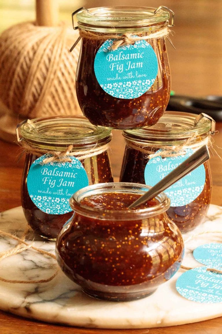Vertical picture of balsamic fig jam in glass jars with blue gift tags