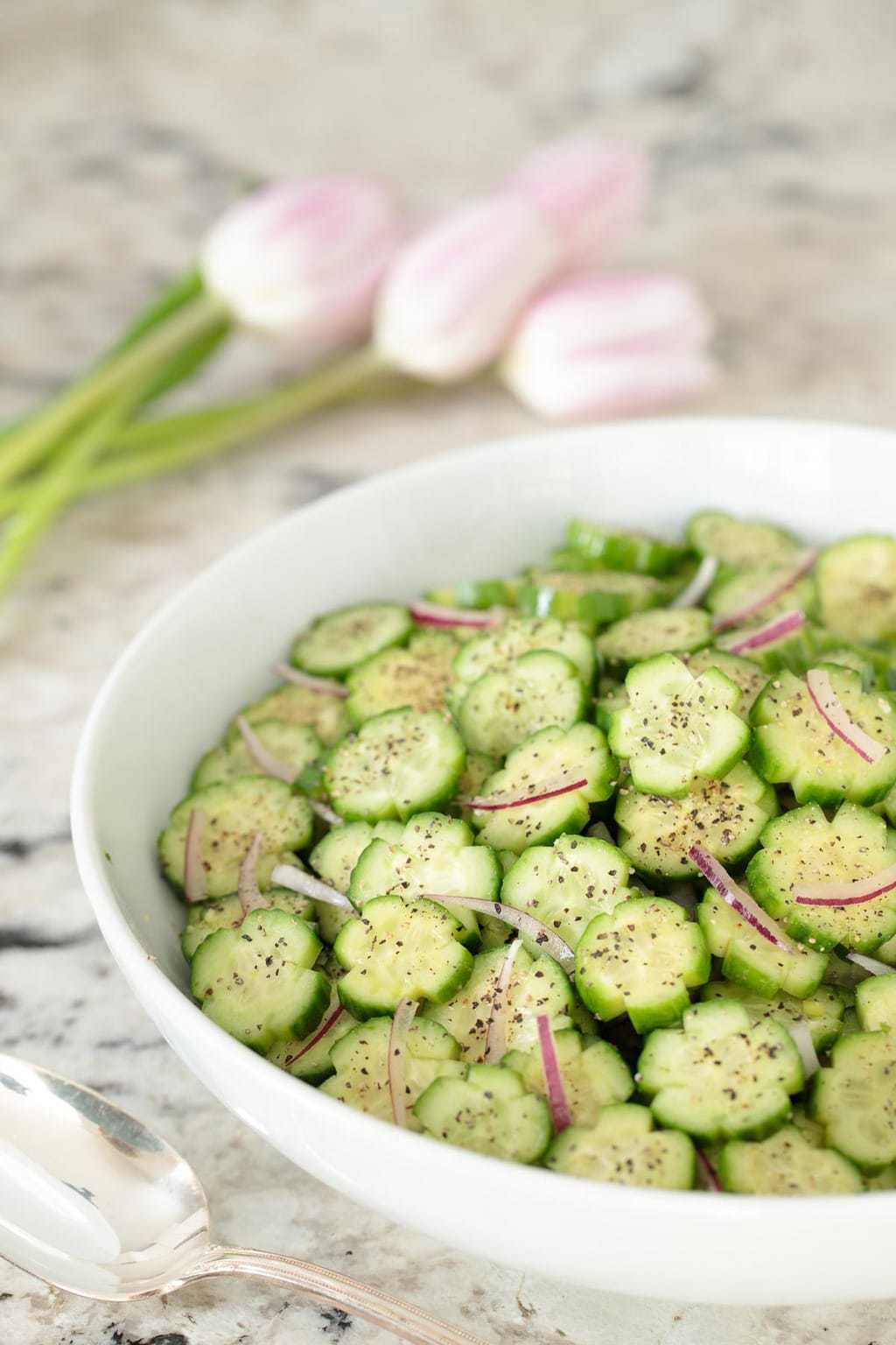Picture of Best Cucumber Salad in a white bowl on a granite countertop
