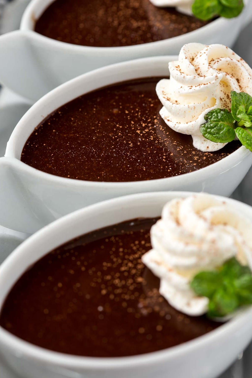 Close up photo of Blender Chocolate Pots de Crème in white serving cups.