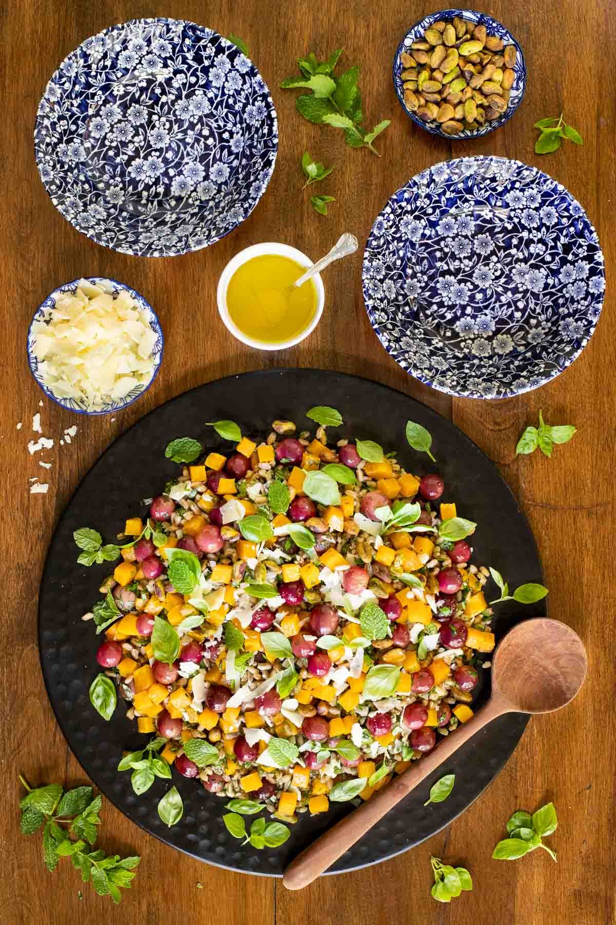 Overhead picture of Roasted Butternut Farro Salad on a wooden table