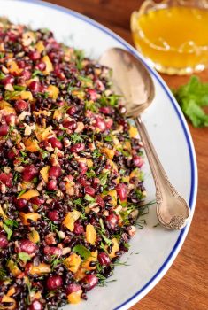 Vertical picture of butternut black rice salad on a white platter