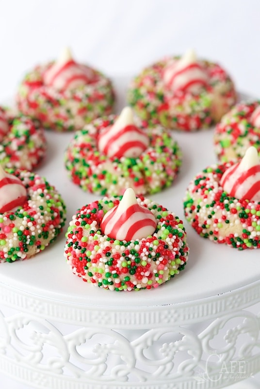 Close up view of Candy Cane Shortbread Cookies on a white cake stand