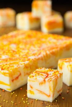 Vertical picture of Candy Corn Swirled Fudge cut into squares
