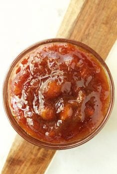 Overhead picture of caramelized banana jam in a small glass bowl