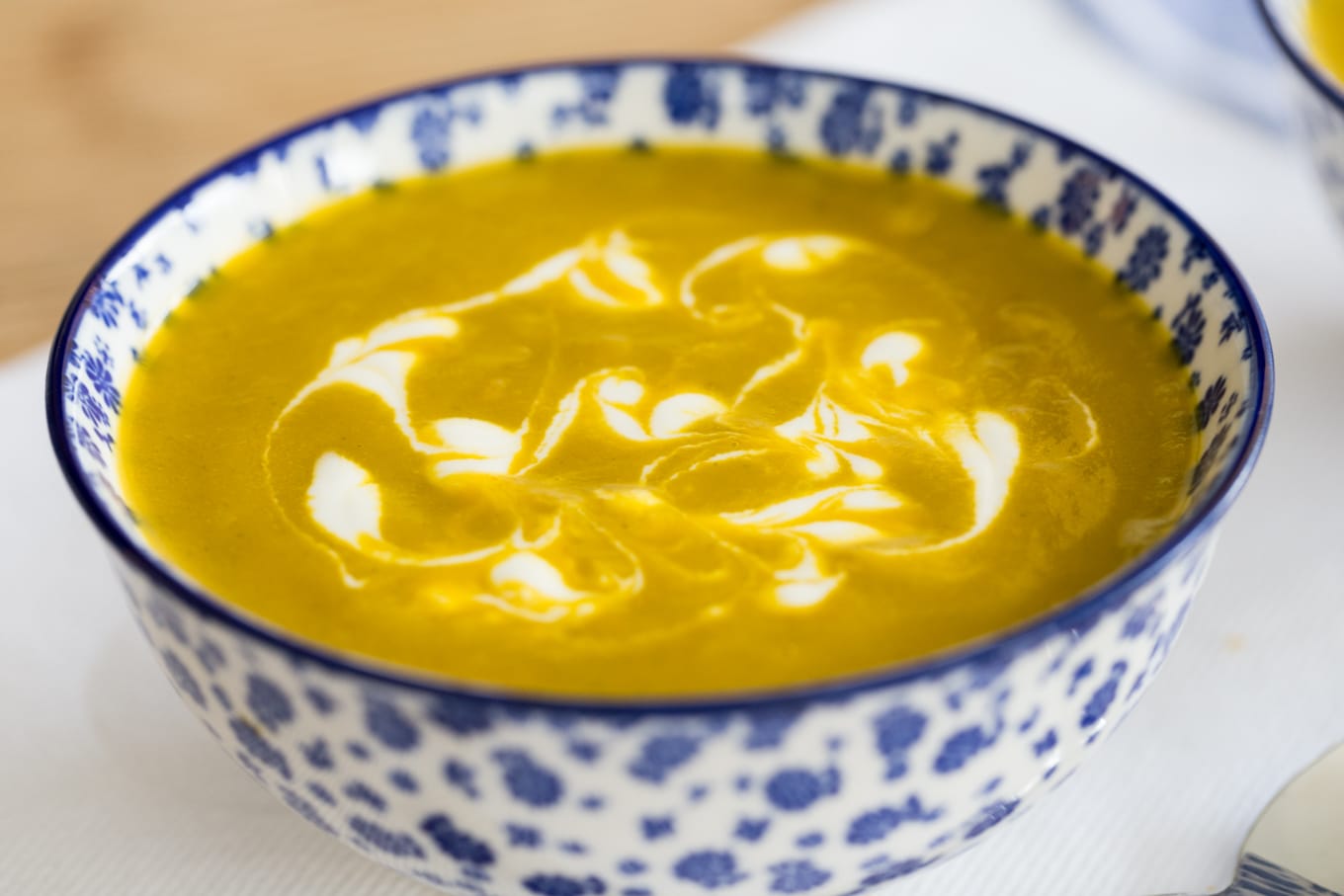 Photo of a bowl of Carrot Coriander Soup.