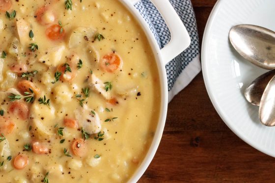 Chicken Cauliflower Cheddar Chowder in a white dutch oven.