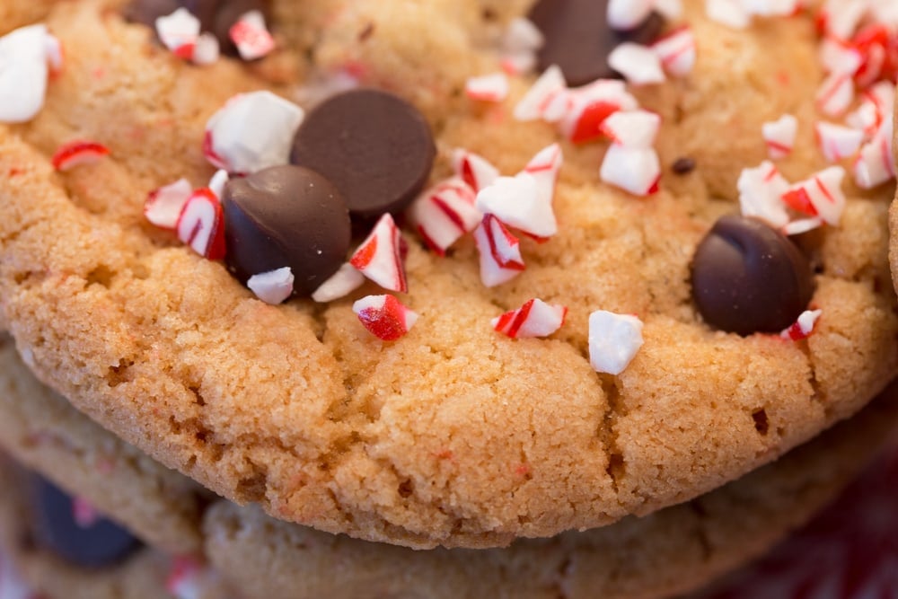 With lots of chocolate chips and crushed peppermint both inside and as a pretty topping, these Easy Candy Cane Chocolate Chip Cookies will disappeared like hotcak