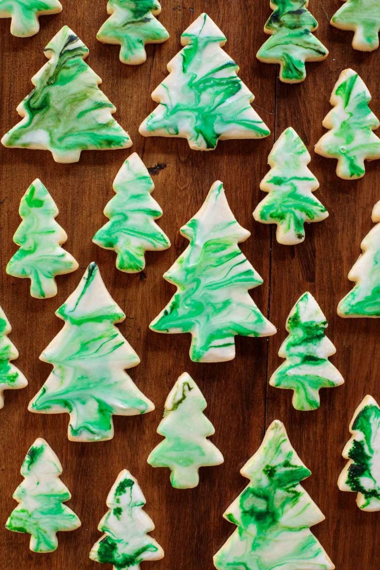 Overhead picture of Christmas tree shortbread cookies on a wooden table