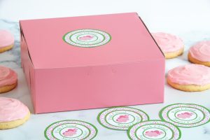 Delicious Pink Cloud Sugar Cookies in personalized pink and green packaging with labels.