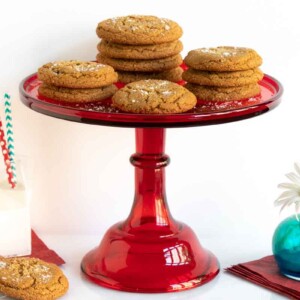 Butterscotch cookies on a red cake stand.