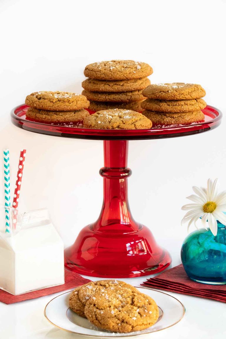 Vertical photo of Crinkly Crackly Butterscotch Cookies on a red glass pedestal serving plate.