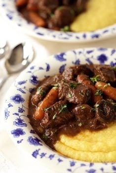 Beef Daube - it's beef stew, Provencal style! Made with red wine, rosemary, thyme and bay leaves, it's slow roasted till all the flavors meld together and the beef is melt in your mouth tender.