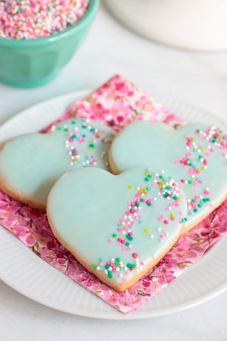 Vertical photo of Valentine Shortbread Heart Cookies on a pink napkin.