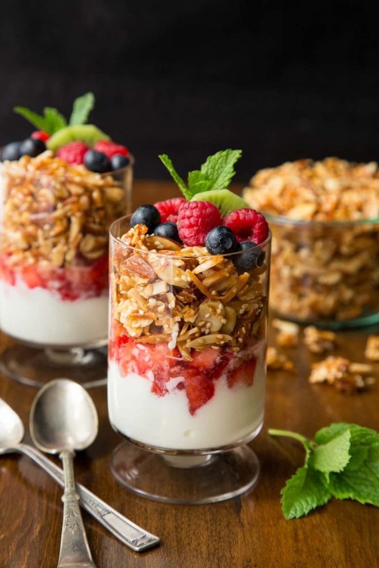 Vertical picture of yogurt and granola parfaits with fruit