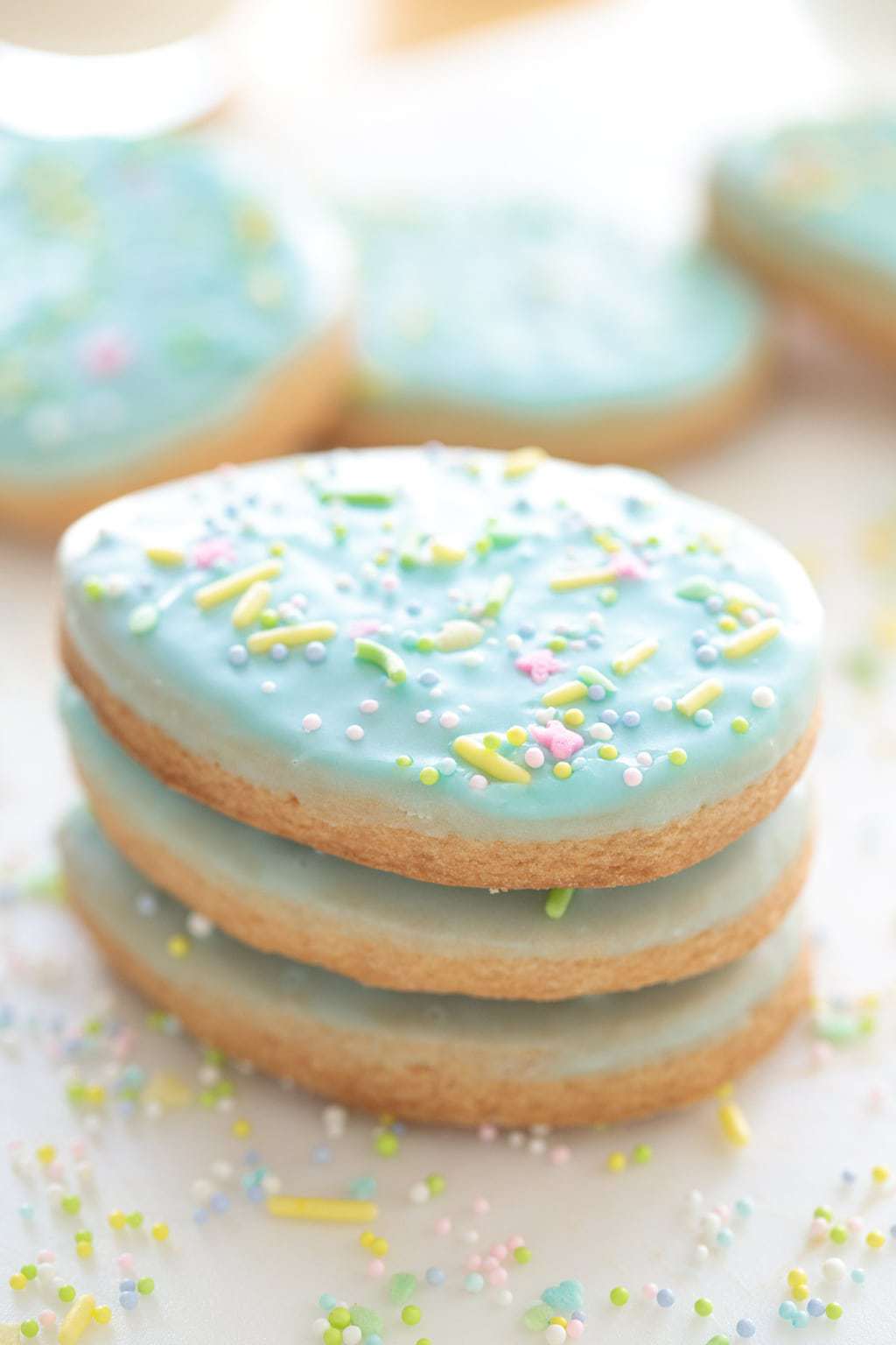 Vertical closeup photo of a stack of Spring Shortbread Cookies.