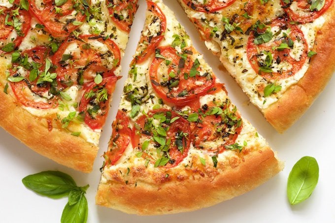Easy Artisan Pizza - an amazingly delicious crust that's tender on the inside and crisp on the outside. With this crust, you can make a delicious, homemade pizza, start to finish, in less than an hour! thecafesucrefarine.com