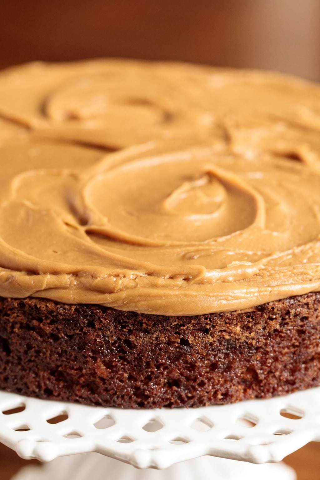 Closeup photo of a Ridiculously Easy Magic Apple Cake with caramel icing.
