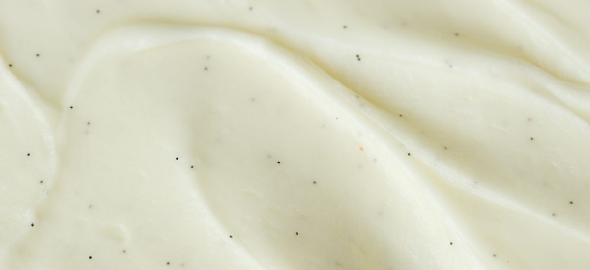 Extreme closeup of the top of an Easy Gingerbread Cake with Vanilla Bean Icing.