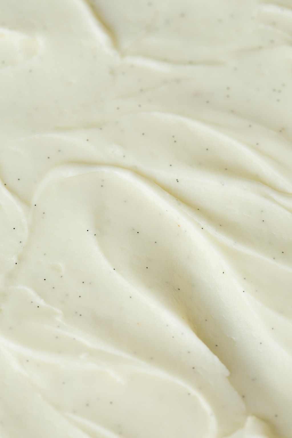Extreme closeup of the top of an Easy Gingerbread Cake with Vanilla Bean Icing.