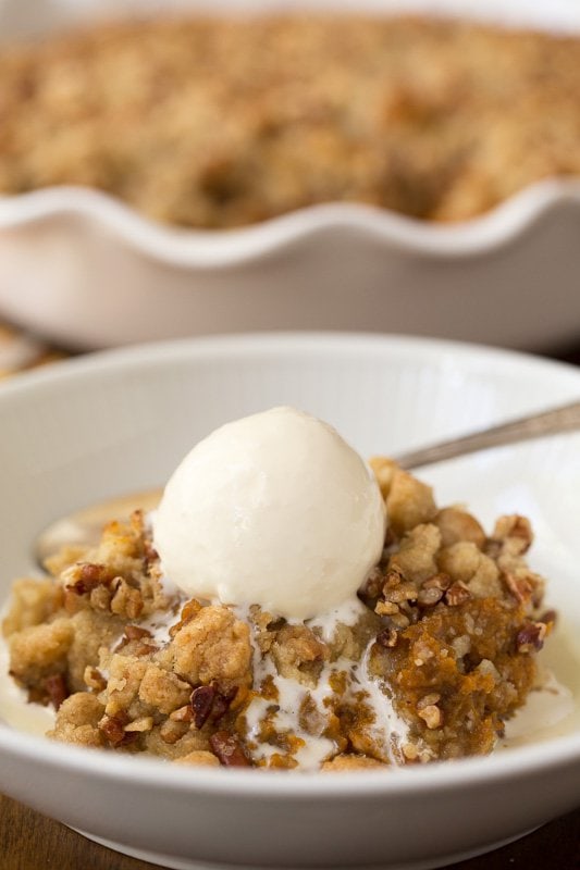 Vertical picture of Easy Pumpkin Cobbler with ice cream in a small dish