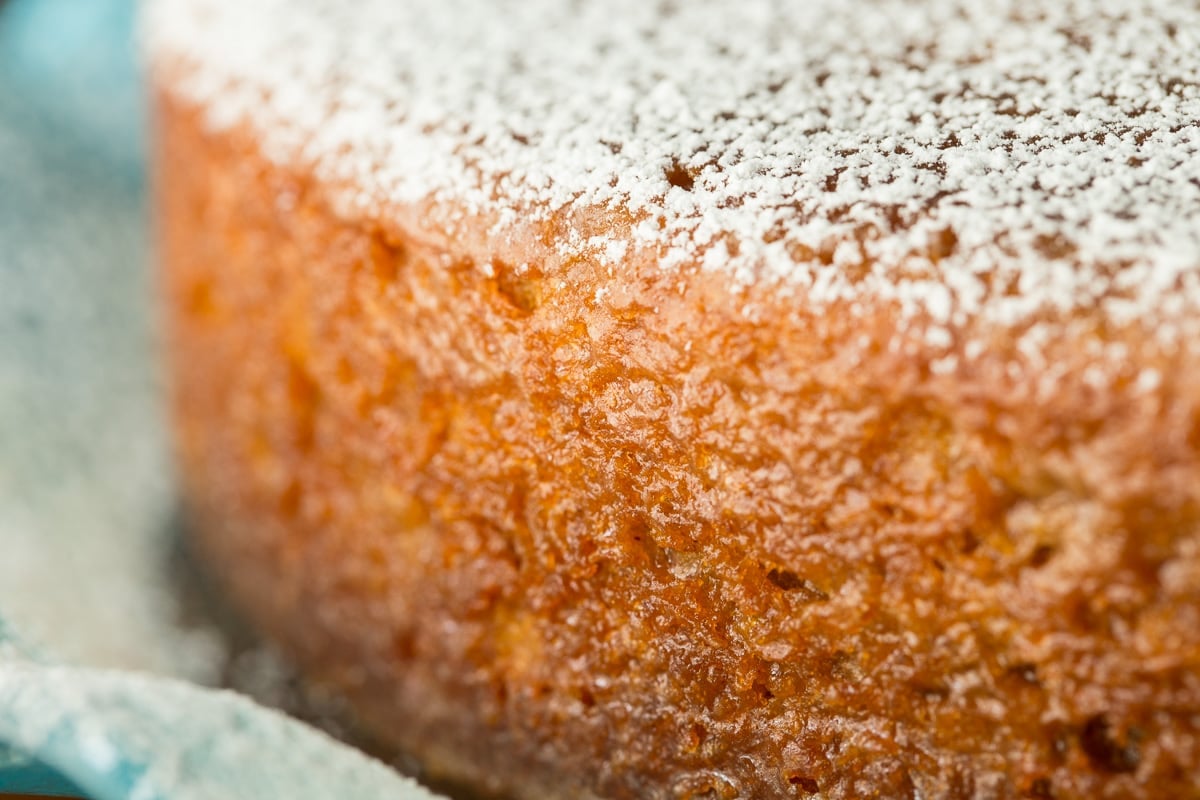 Ultra closeup photo of the side of a Fall Spice Cake with Maple Glaze.