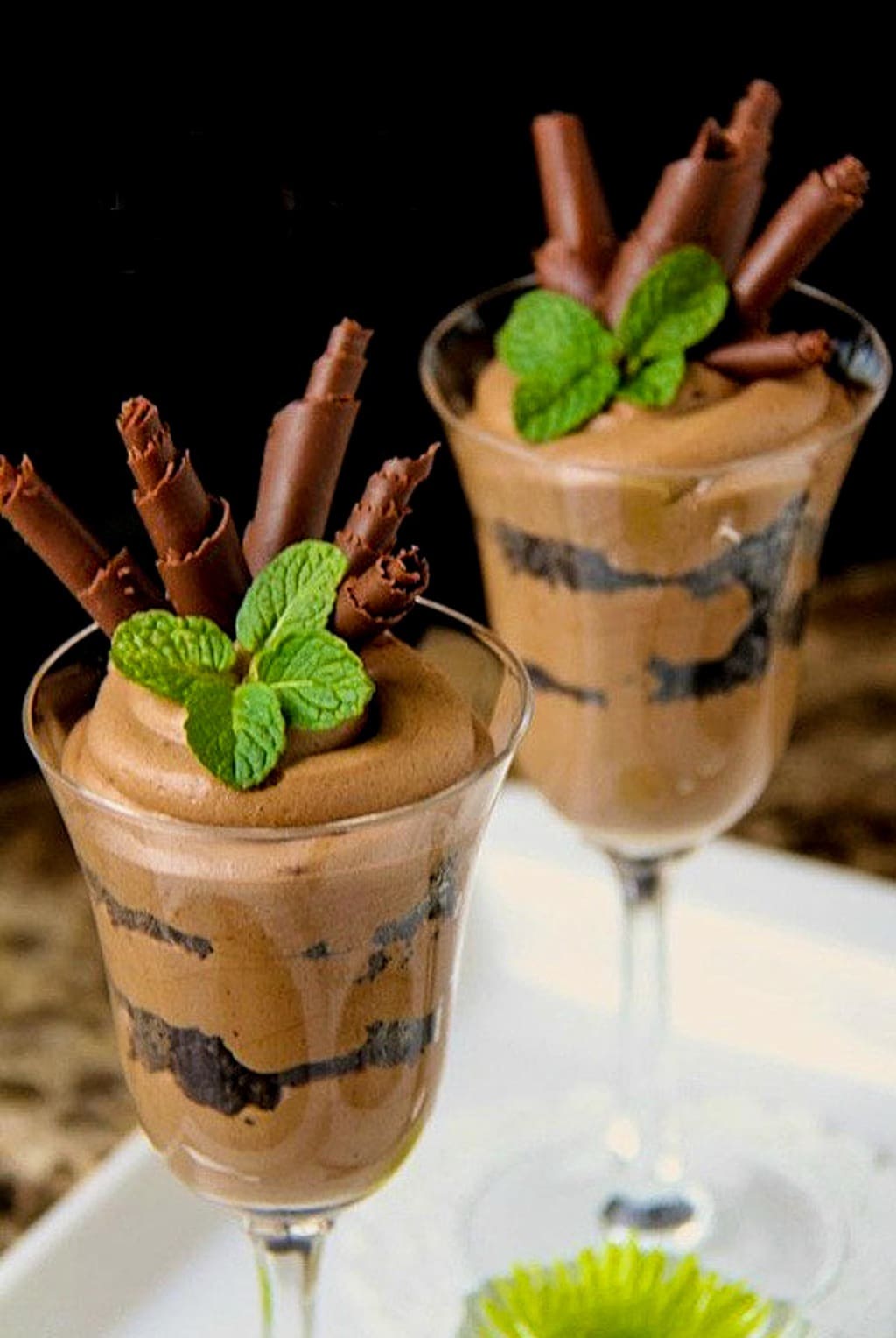 Photo of two parfait glasses filled with Bailey's Irish Cream French Silk and garnished with mint and chocolate curls.