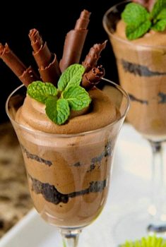 Vertical picture of chocolate french silk in glasses garnished with chocolate curls and mint