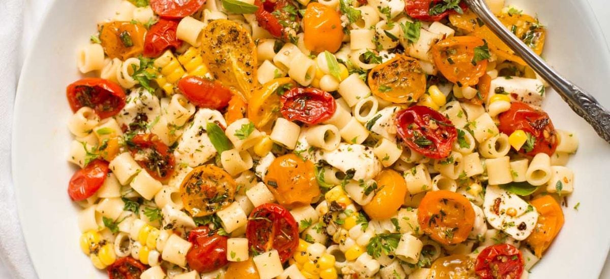 Overhead picture of Roasted Tomato and Fresh Mozzarella Pasta in a white bowl