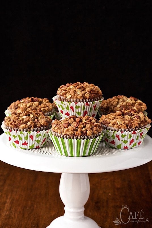 Vertical picture of gingerbread morning glory muffins on a white cake stand