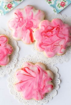 Glazed Shortbread Cutout Cookies - melt in your mouth buttery crisp shortbread cookies with a beautiful (and delicious!) glaze.