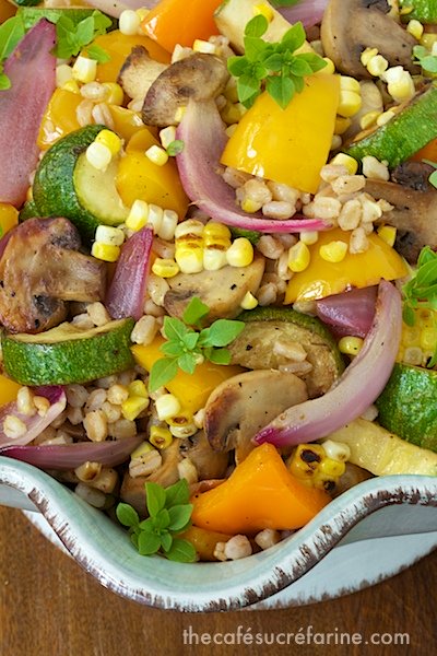 Overhead closeup of a serving dish of Grill Roasted Vegetable Farro Salad