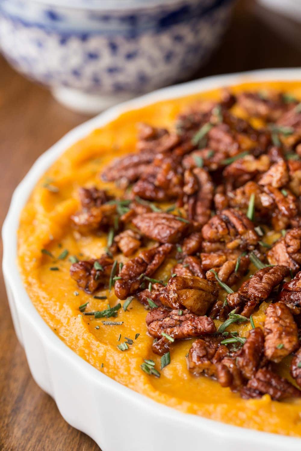 Combining sweet potatoes, butternut squash, maple syrup and a pinch of cinnamon and curry, this healthy sweet potato casserole wows everyone!