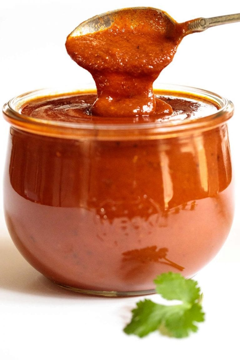 Vertical picture of a glass jar of homemade enchilada sauce