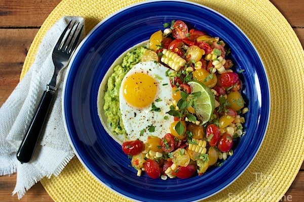 Huevos Rancheros - a healthy and super-delicious take on this classic Southwestern dish, featuring sweet, tender corn, tomatoes and California Avocados.