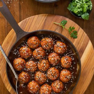 Overhead picture of Huli Huli Chicken meatballs in a cast iron skillet