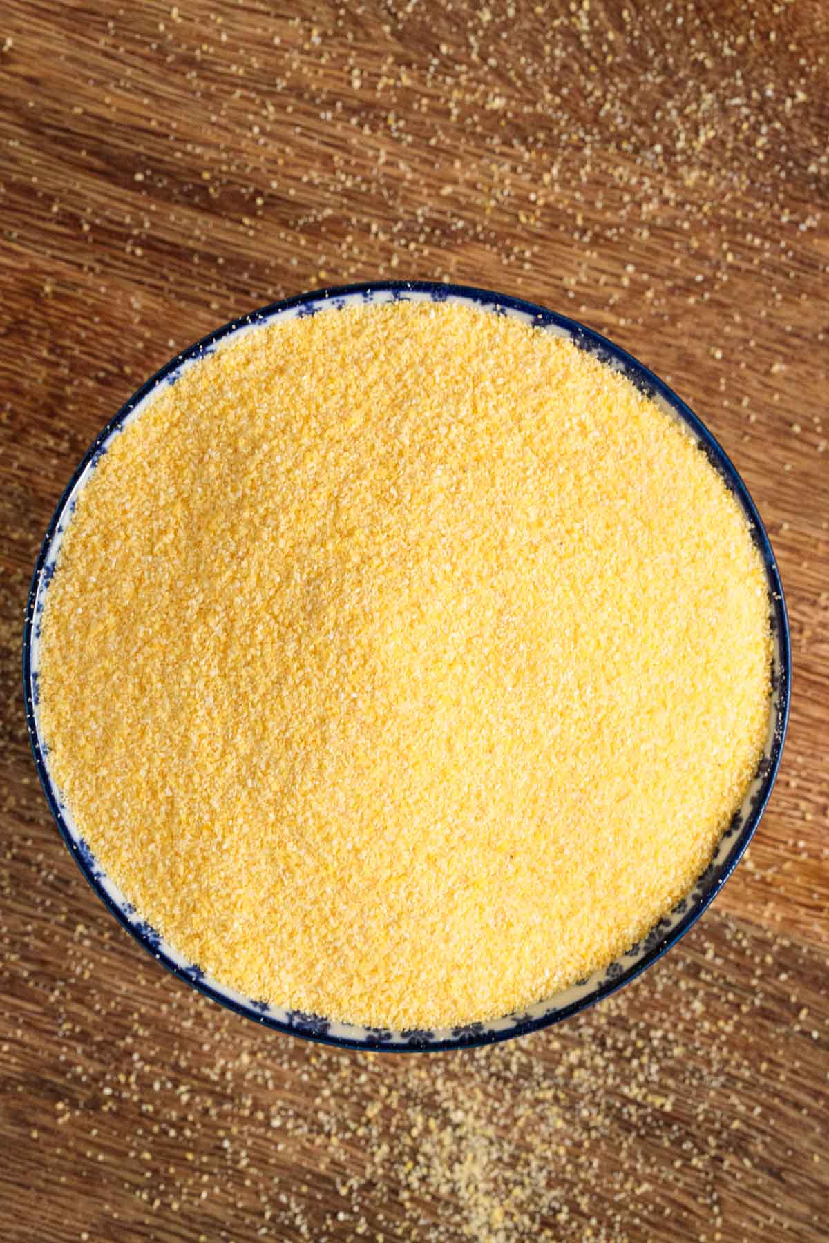 Overhead photo of a bowl of uncooked polenta.