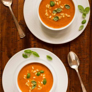 Overhead picture of Italian Sun Dried Tomato Soup in white bowls on a wooden table