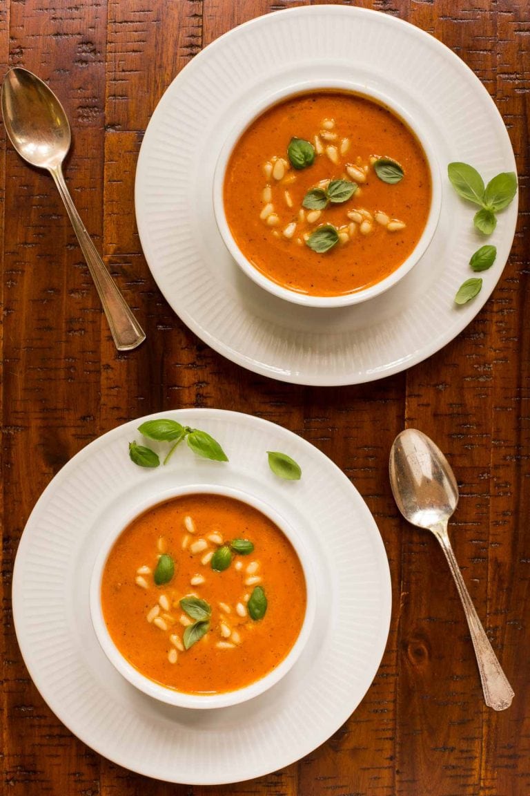 Overhead picture of Italian Sun Dried Tomato Soup in white bowls on a wooden table