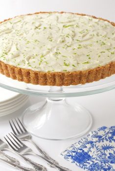 Key Lime Crunch Tart - with a crunchy coconut-almond shortbread crust and a creamy, light key lime filling, this easy, make-ahead tart is ALWAYS a hit!