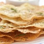 Close up vertical picture of Lemon Rosemary Flatbread Crackers in a stack