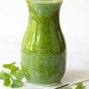 Vertical picture of Lemongrass Cilantro Salad Dressing in a glass jar