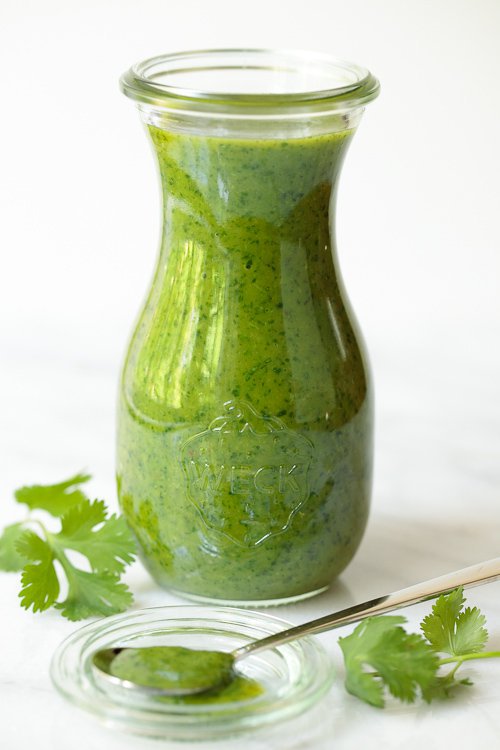 Vertical picture of Lemongrass Cilantro Salad Dressing in a glass jar