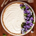 Overhead picture of limoncello lemon tart garnished with purple flowers