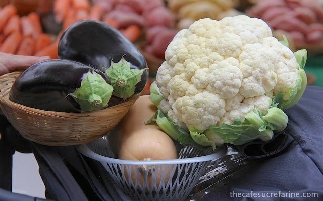Bow's of eggplant, butternut squash and cauliflower at a farmer's market in London, England.