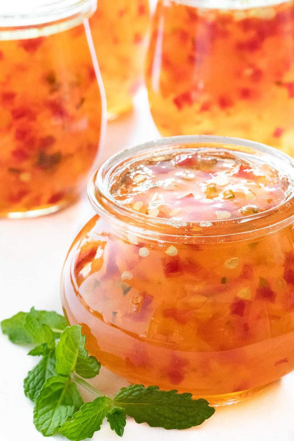 Vertical picture of pepper jelly in a glass jar