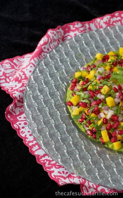 This Mango and Pomegranate Guacamole can be served with tortilla or pita chips, on crostini, or as a lovely, unique side dish. It's always sure to dazzle!