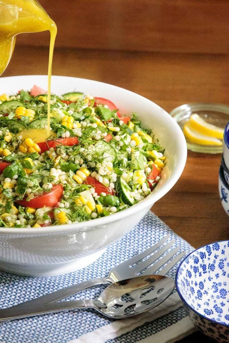 Vertical picture of Mediterranean Couscous Salad in a white bowl