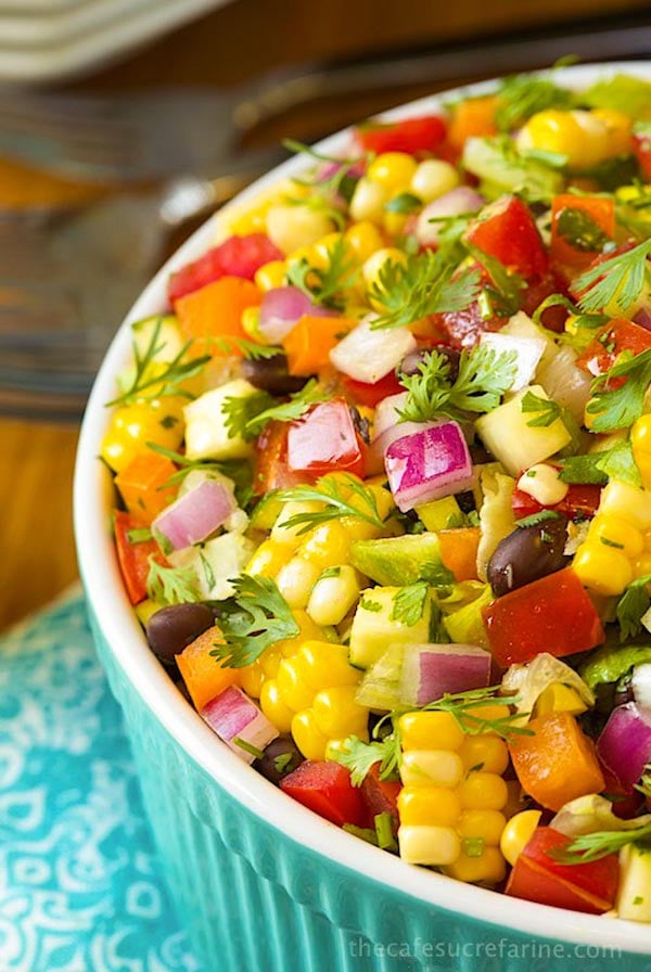 Closeup image of a turquoise bowl filled with Mexican Chopped Salad.